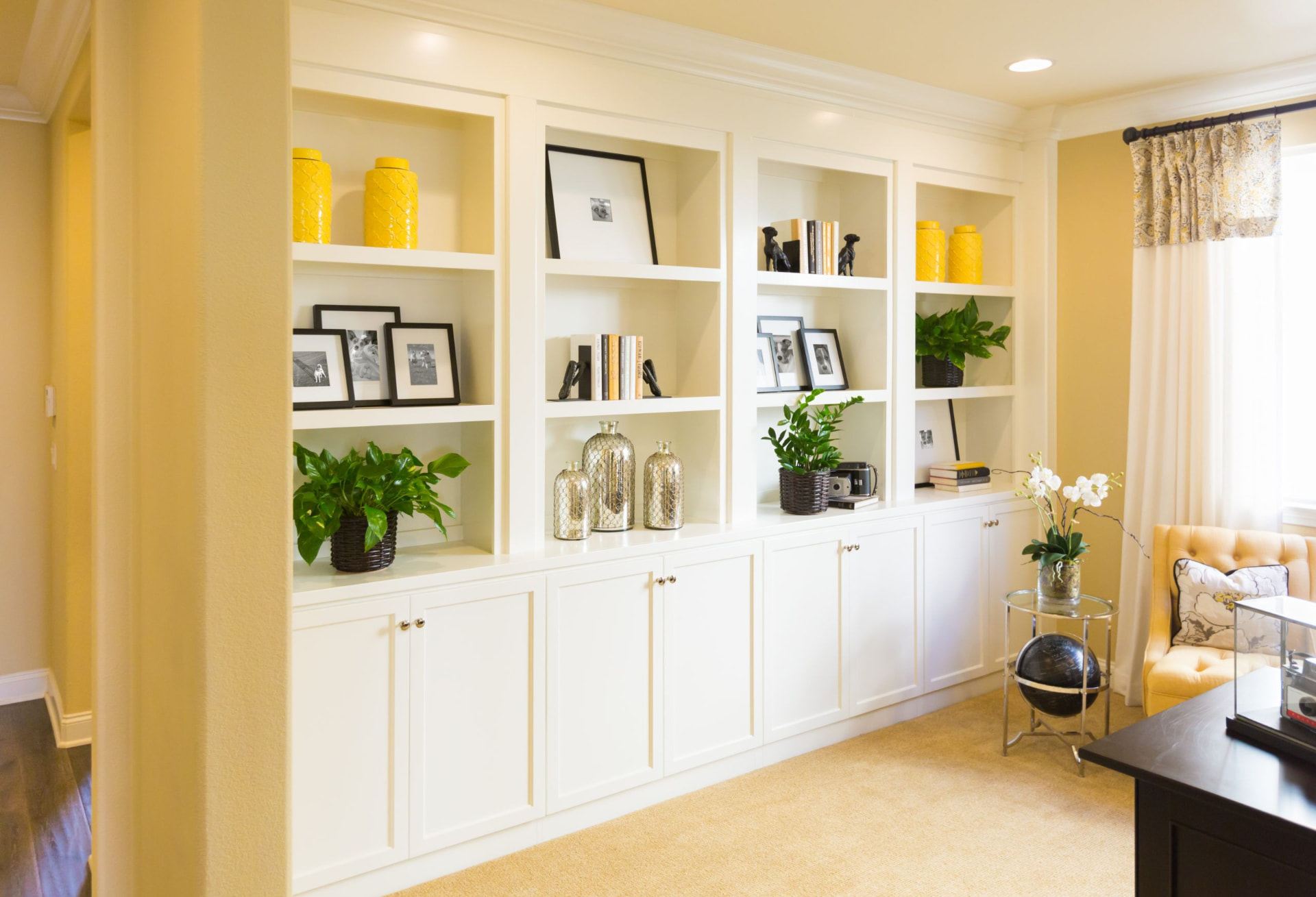Custom built-in white bookshelves and cabinetry