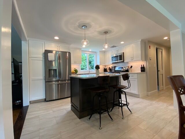 Open kitchen and living area created by a home addition